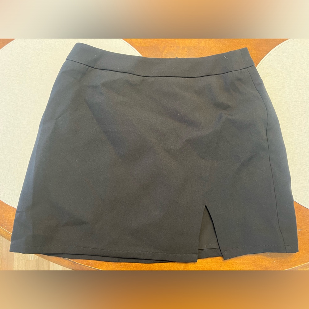 NWOT black Revolve mini skirt